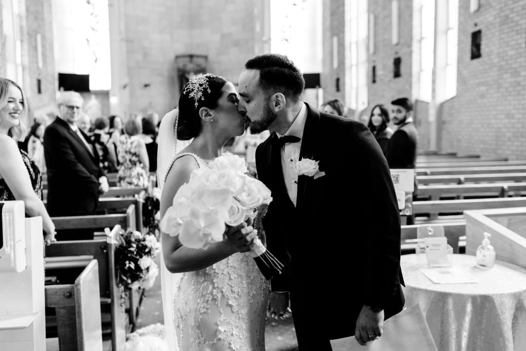 ST-PETER-CHANEL-CATHOLIC-CHURCH-BERALA-SYDNEY-WEDDING-PHOTOGRAPHER-ANELLOWEDDINGS-KISS