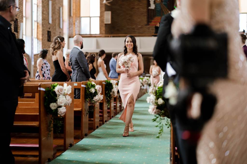 ST-PETER-CHANEL-CATHOLIC-CHURCH-BERALA-SYDNEY-WEDDING-PHOTOGRAPHER-ANELLOWEDDINGS-BRIDESMAID-WALKING