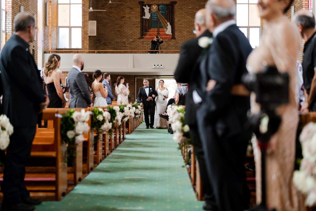 ST-PETER-CHANEL-CATHOLIC-CHURCH-BERALA-SYDNEY-WEDDING-PHOTOGRAPHER-ANELLOWEDDINGS-BRIDE-WALKING-DOWN-ALTER