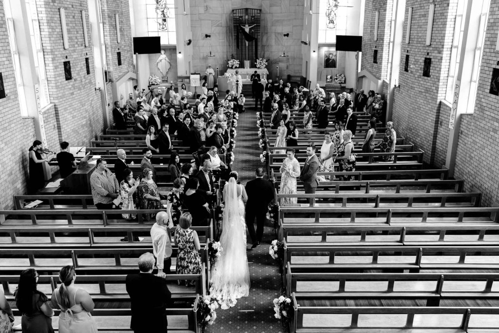 ST-PETER-CHANEL-CATHOLIC-CHURCH-BERALA-SYDNEY-WEDDING-PHOTOGRAPHER-ANELLOWEDDINGS-BRIDE-DOWN-ALTER