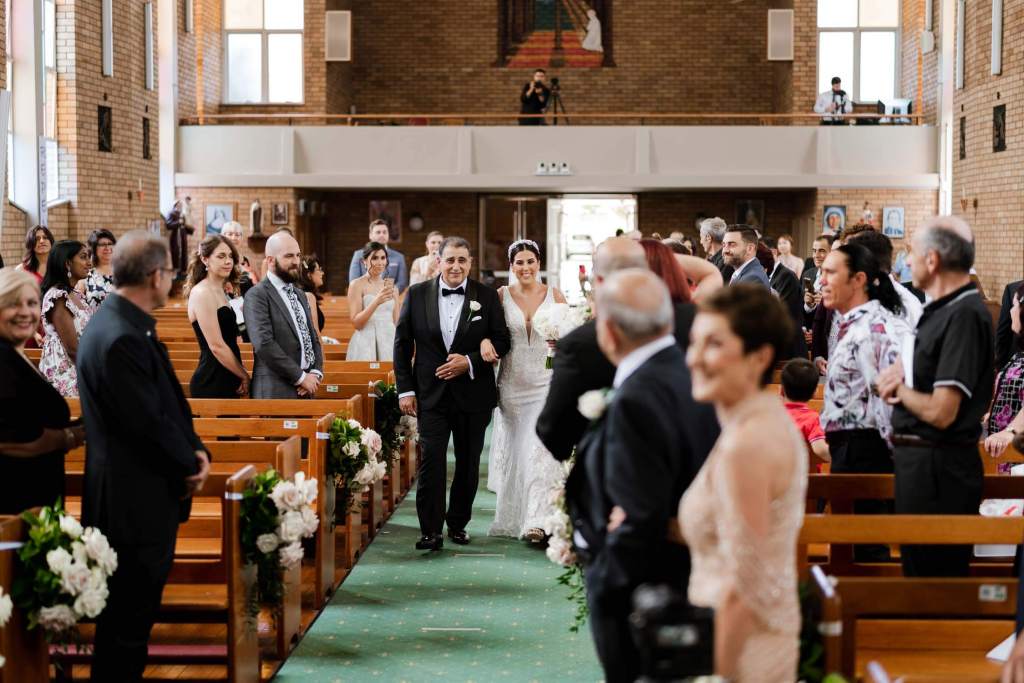ST-PETER-CHANEL-CATHOLIC-CHURCH-BERALA-SYDNEY-WEDDING-PHOTOGRAPHER-ANELLOWEDDINGS-BRIDE-FATHER-DAUGHTER-WALKING-DOWN-ALTER