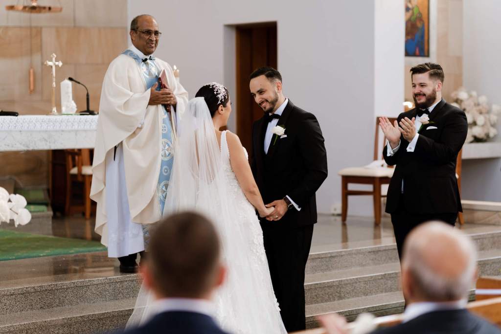 ST-PETER-CHANEL-CATHOLIC-CHURCH-BERALA-SYDNEY-WEDDING-PHOTOGRAPHER-ANELLOWEDDINGS-SMILING-GROOM