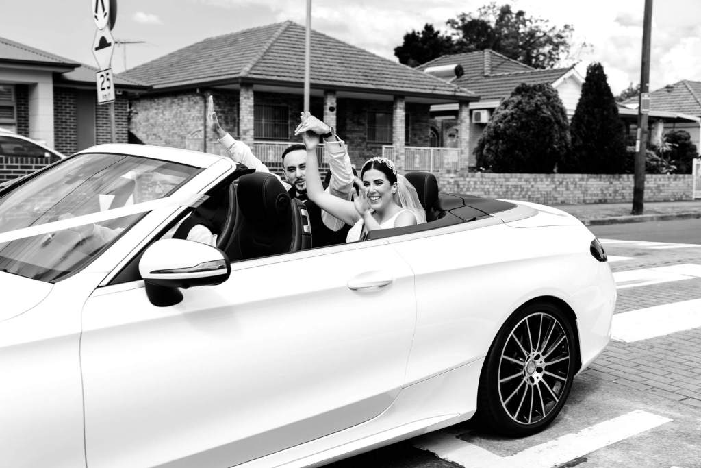 ST-PETER-CHANEL-CATHOLIC-CHURCH-BERALA-SYDNEY-WEDDING-PHOTOGRAPHER-ANELLOWEDDINGS-BRIDE-KISSING-JUST-MARRIED