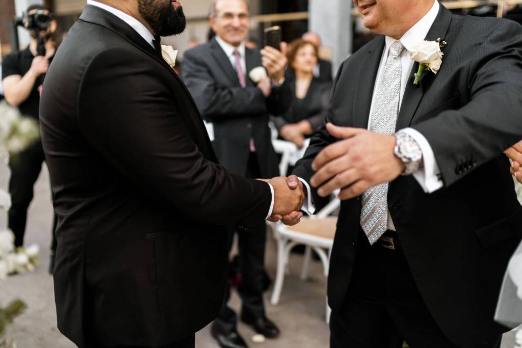 VIEW-BY-SYDNEY-PIER-ONE-WEDDING-PHOTOGRAPHER-ANELLOWEDDINGS-HANDSHAKE-FATHER-SON-IN-LAW
