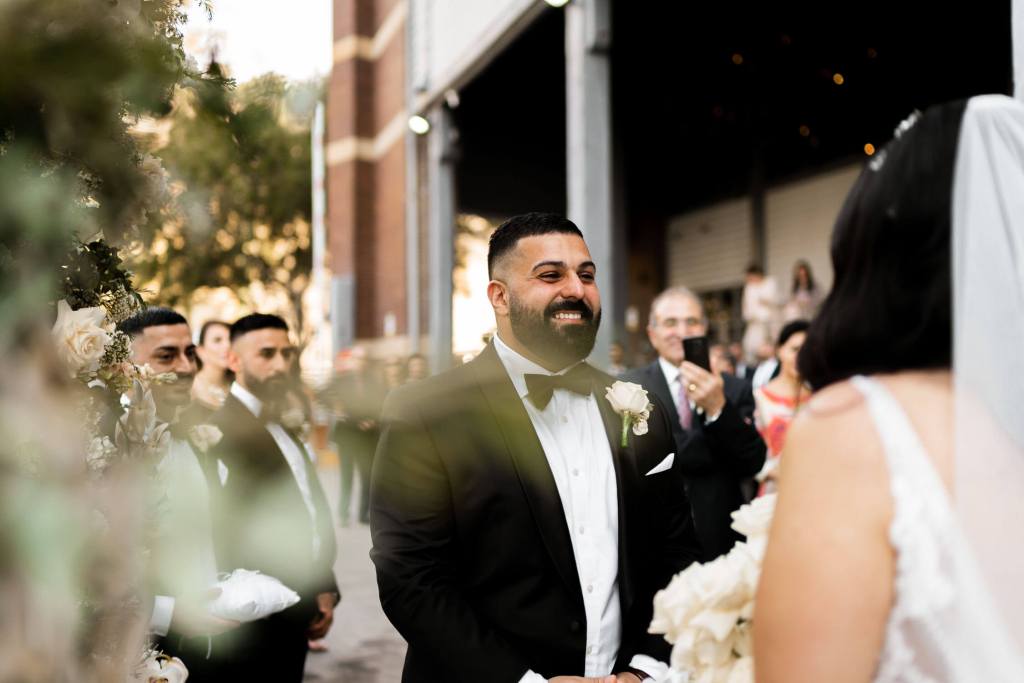 VIEW-BY-SYDNEY-PIER-ONE-WEDDING-PHOTOGRAPHER-ANELLOWEDDINGS-SMILING-GROOM