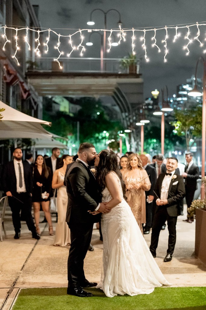 VIEW-BY-SYDNEY-PIER-ONE-WEDDING-PHOTOGRAPHER-ANELLOWEDDINGS-WEDDING-EXITS-COUPLE