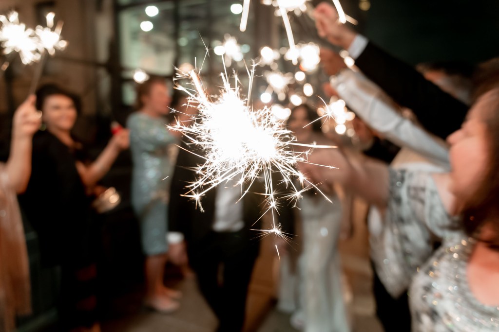 VIEW-BY-SYDNEY-PIER-ONE-WEDDING-PHOTOGRAPHER-ANELLOWEDDINGS-WEDDING-EXITS-COUPLE-SPARKLERS