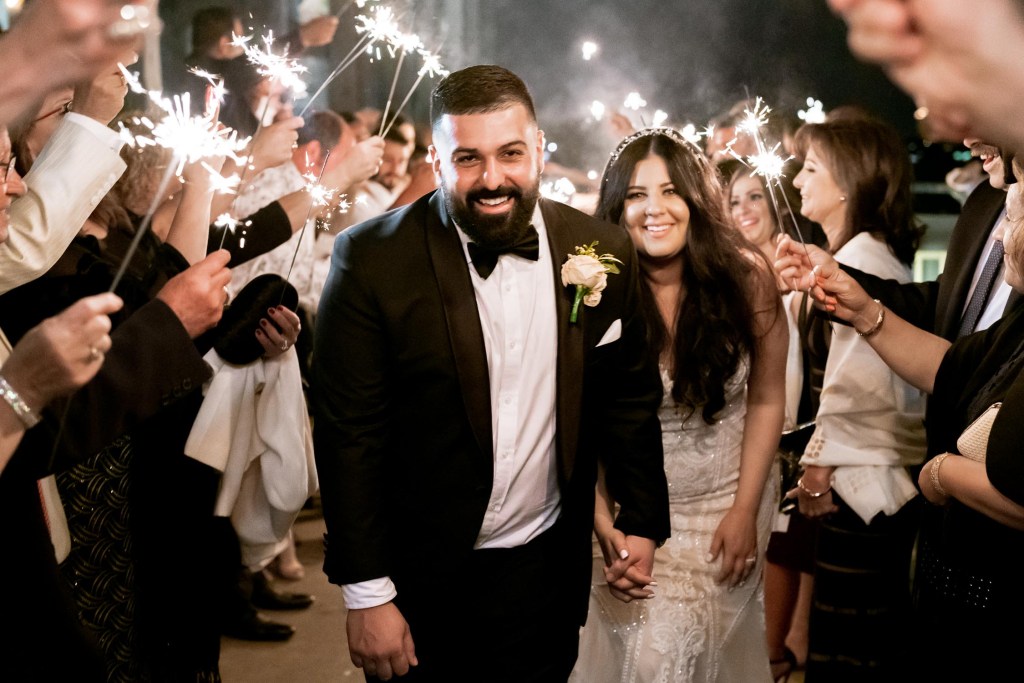 VIEW-BY-SYDNEY-PIER-ONE-WEDDING-PHOTOGRAPHER-ANELLOWEDDINGS-WEDDING-EXITS-COUPLE-SPARKLERS