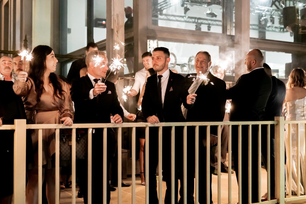 VIEW-BY-SYDNEY-PIER-ONE-WEDDING-PHOTOGRAPHER-ANELLOWEDDINGS-WEDDING-EXITS-COUPLE-SPARKLERS