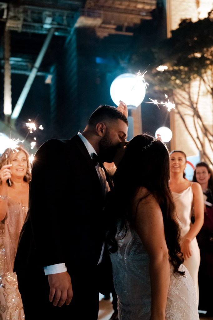 VIEW-BY-SYDNEY-PIER-ONE-WEDDING-PHOTOGRAPHER-ANELLOWEDDINGS-WEDDING-EXITS-COUPLE-SPARKLERS
