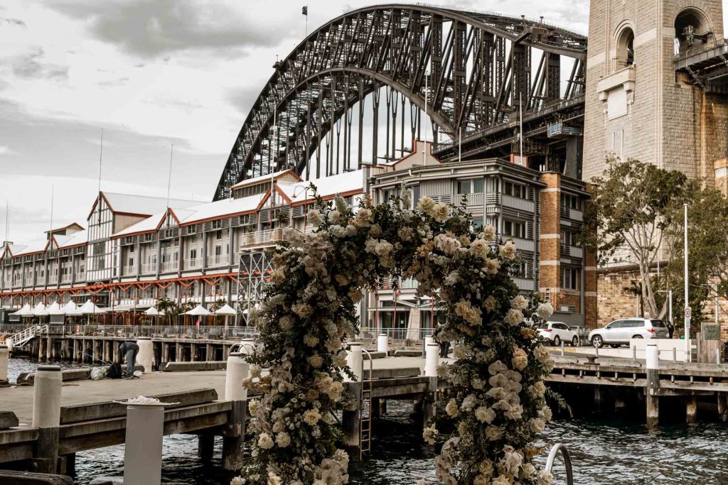 VIEW-BY-SYDNEY-PIER-ONE-WEDDING-PHOTOGRAPHER-ANELLOWEDDINGS-HARBOUR-FLOWER-ARCH-MADAME-FLEUR