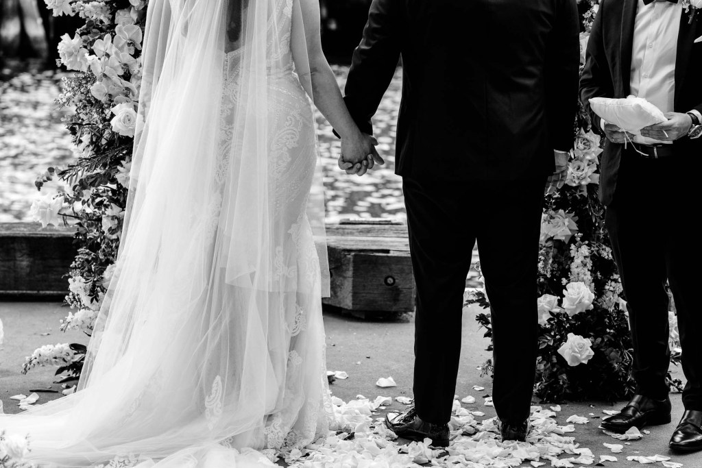 VIEW-BY-SYDNEY-PIER-ONE-WEDDING-PHOTOGRAPHER-ANELLOWEDDINGS-HOLDING-HANDS