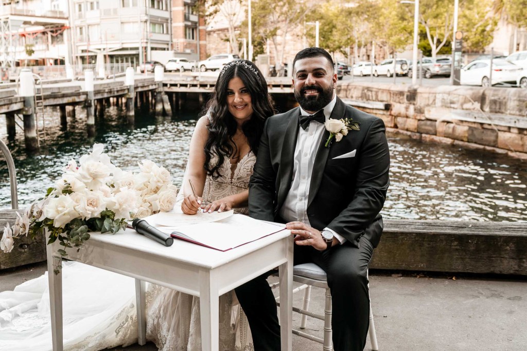 VIEW-BY-SYDNEY-PIER-ONE-WEDDING-PHOTOGRAPHER-ANELLOWEDDINGS-SIGNING-MARRIAGE-CERTIFICATE