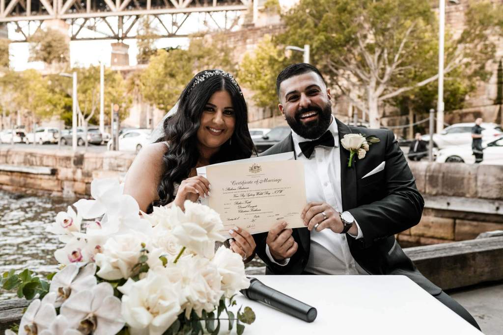 VIEW-BY-SYDNEY-PIER-ONE-WEDDING-PHOTOGRAPHER-ANELLOWEDDINGS-SIGNING-MARRIAGE-CERTIFICATE