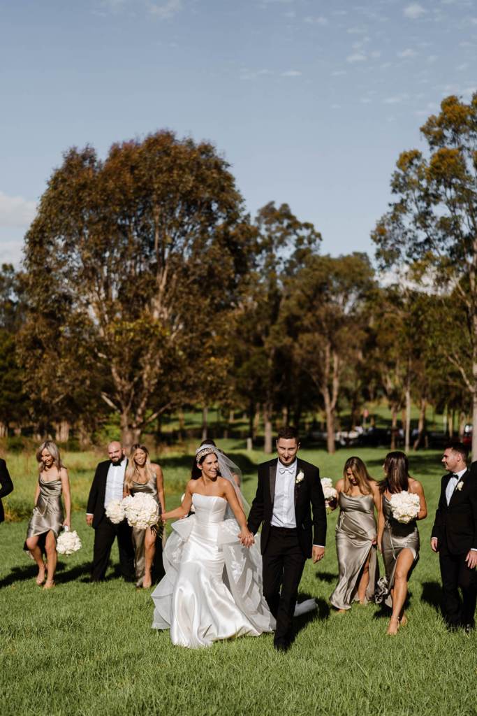 WESTERN-SYDNEY-PARKLANDS-THE-DAIRY-ABBOTSBURY-SYDNEY-PHOTOGRAPHERS-ANELLOWEDDINGS-WALKING-BRIDAL-PARTY
