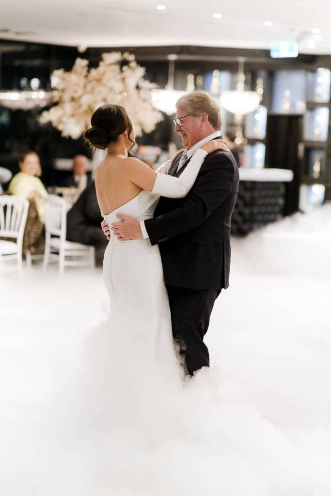 father daughter dancing in smoke