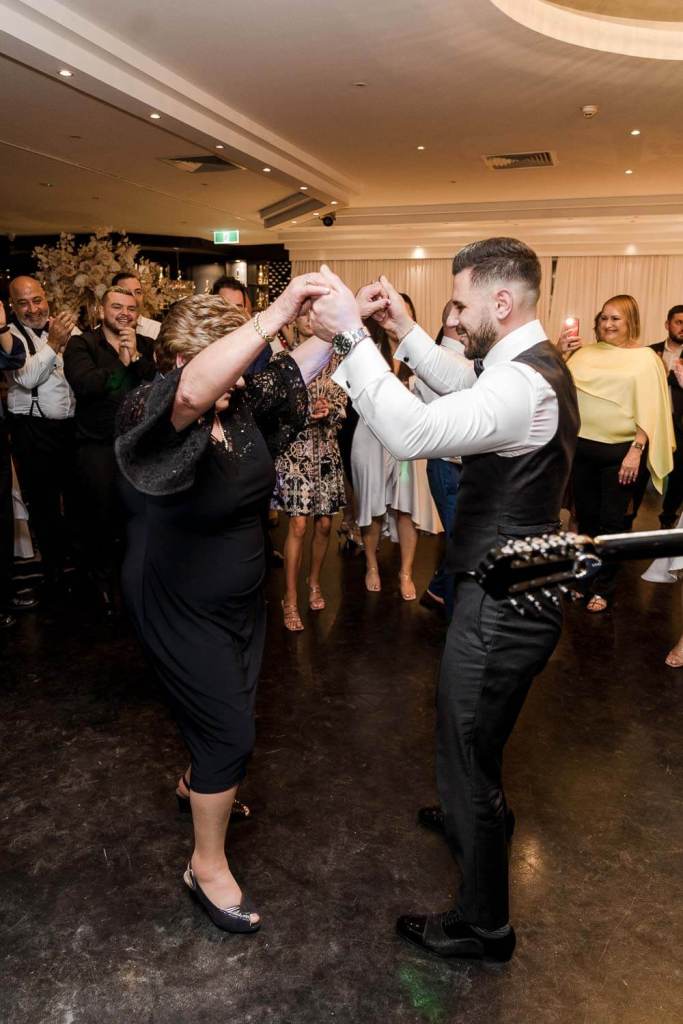 groom with grandma having fun on dancefloor