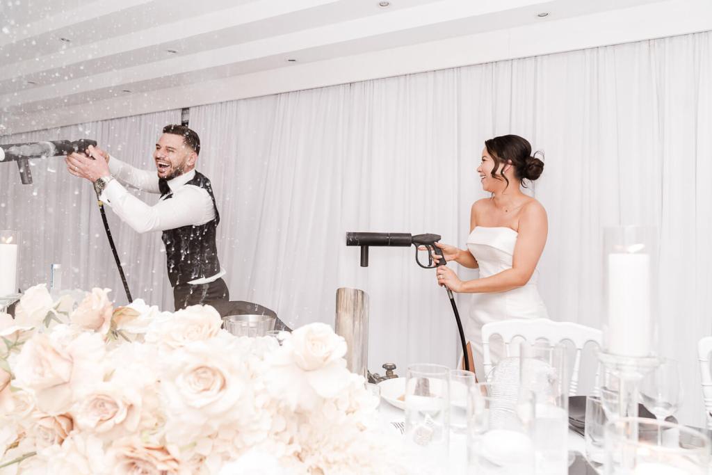 bride and groom use smoke guns