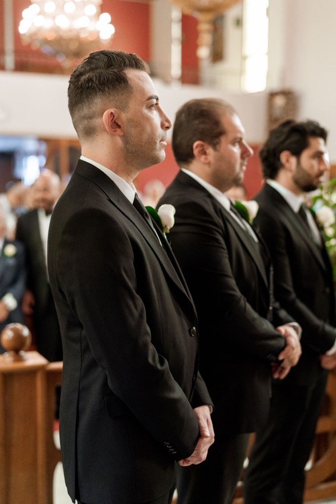 groomsman standing at church