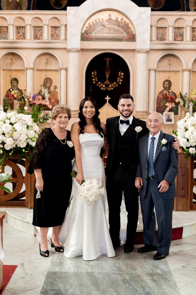 grooms family smiling inside church