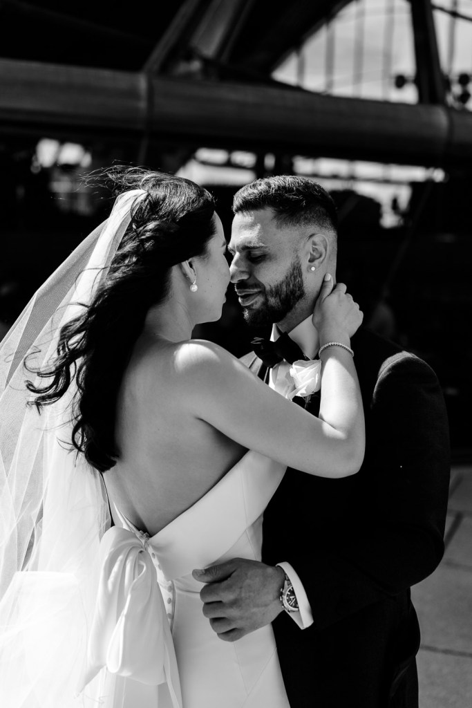 bride and groom head touch at opera house