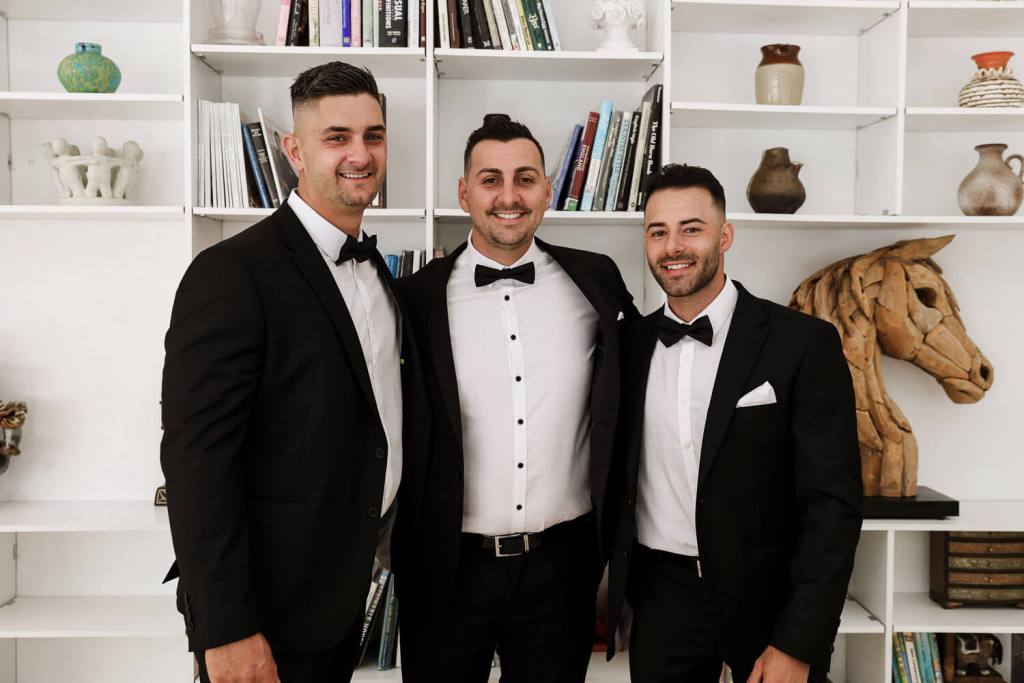 Groomsmen drinking at grooms