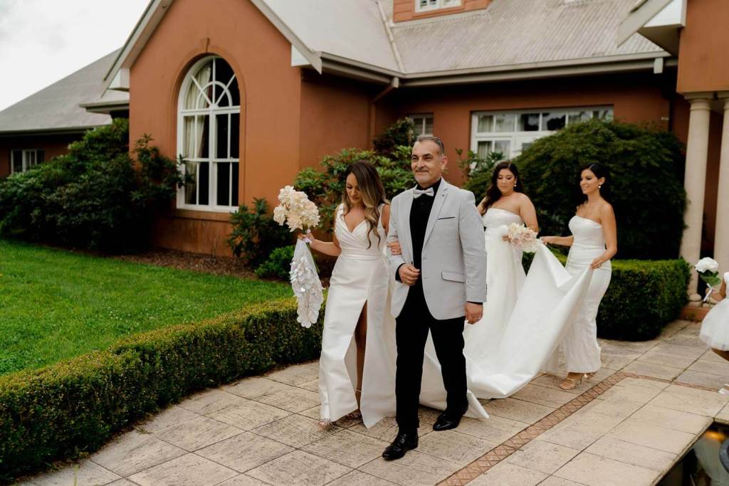 Bride walking out of home