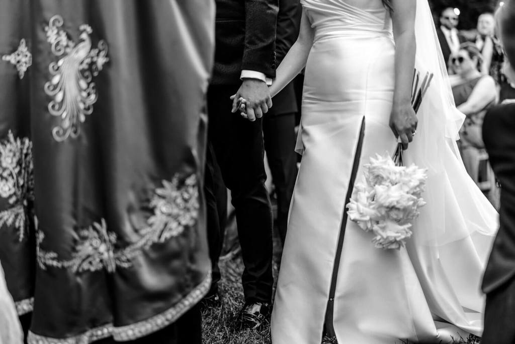 Bride and groom holding hands
