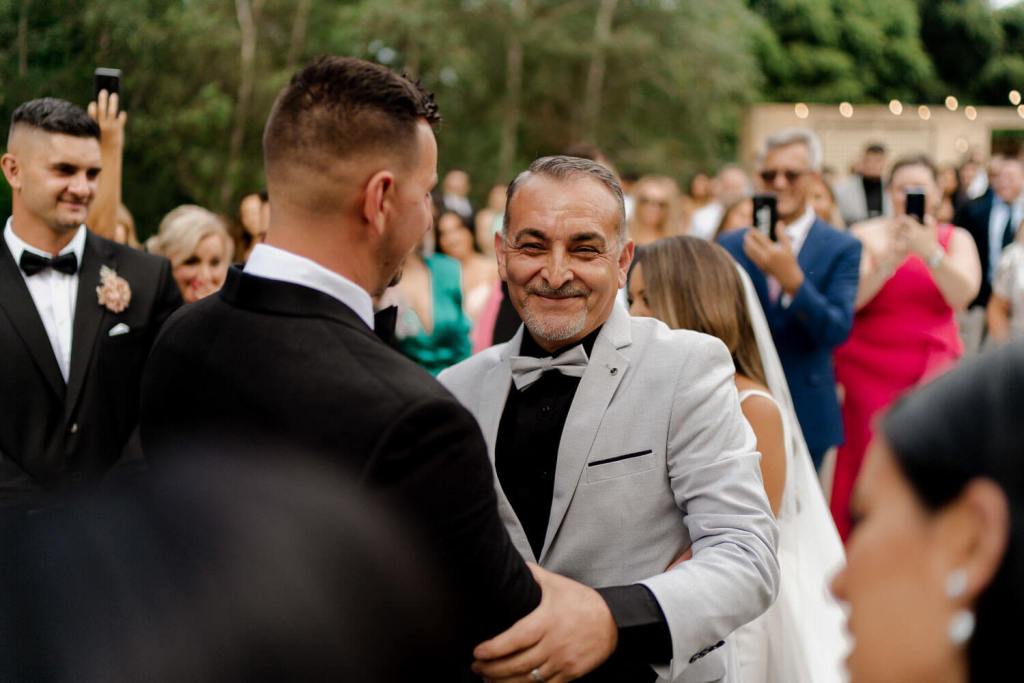 Groom and dad handshake