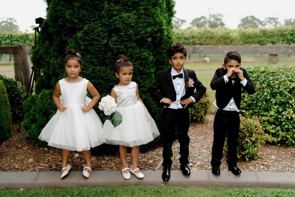 Page boy and girls standing