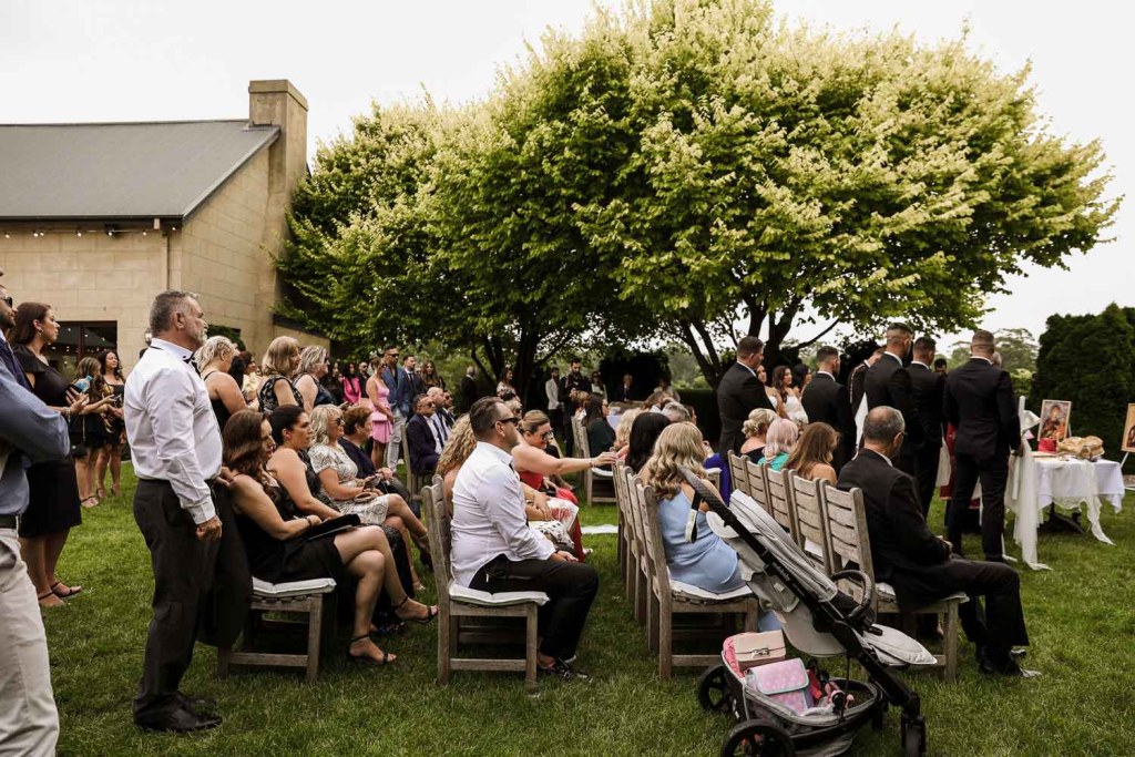 Guests at watching outdoor ceremony