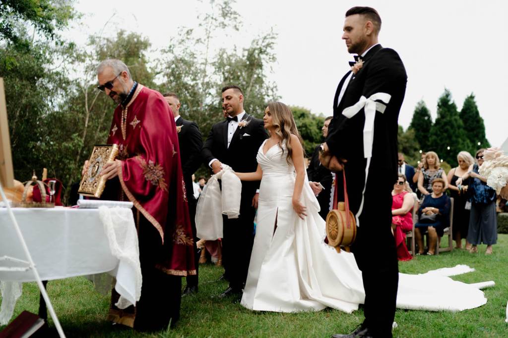 Bride and groom standing at garden