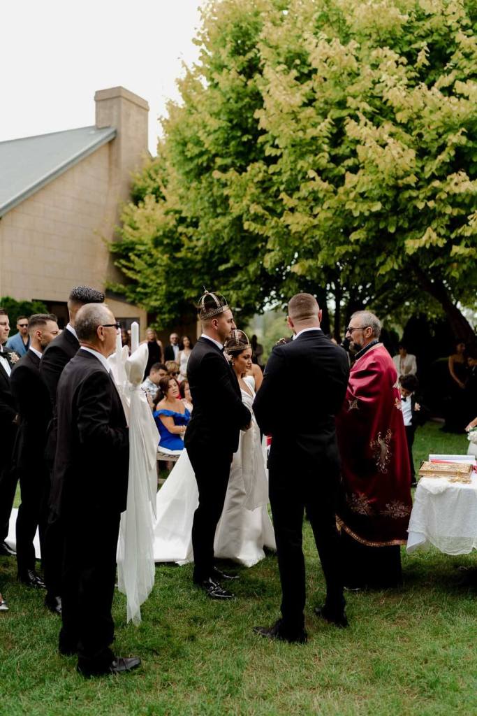 Guests at watching outdoor ceremony