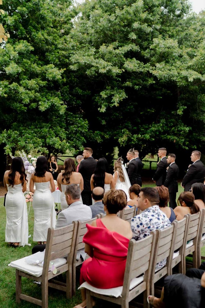 Guests at watching outdoor ceremony