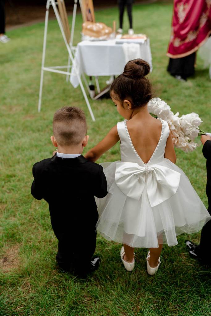 Page boy and page girl holding hands