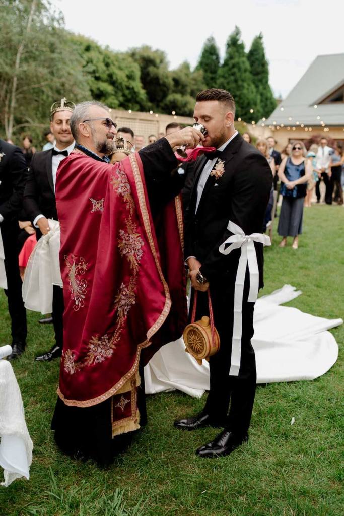 Best man drinking church wine