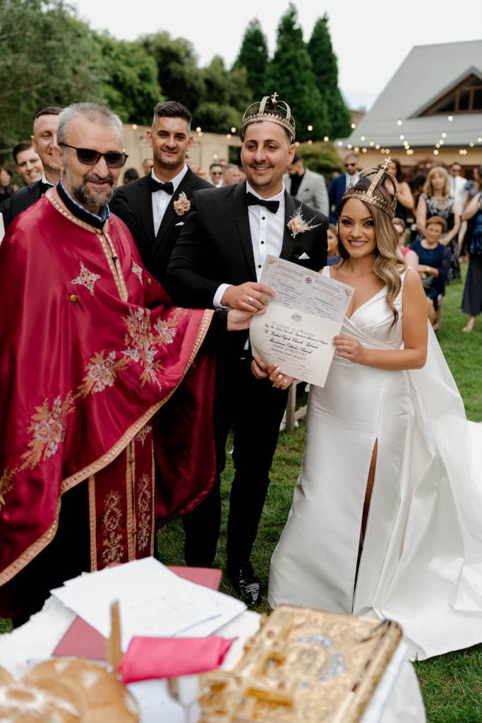 Smiling couple with marriage certificate