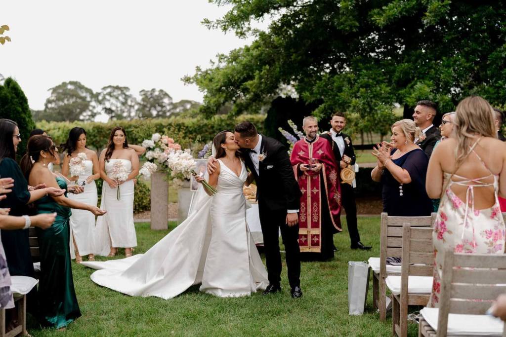 Bride and groom first kiss