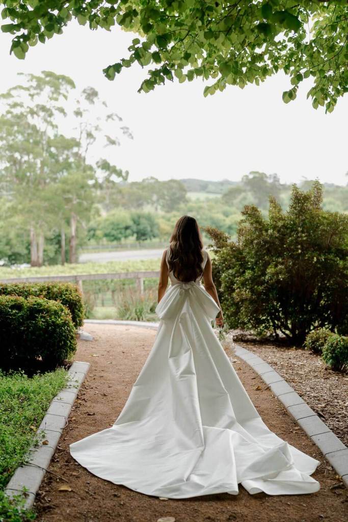 Bride walking in garden