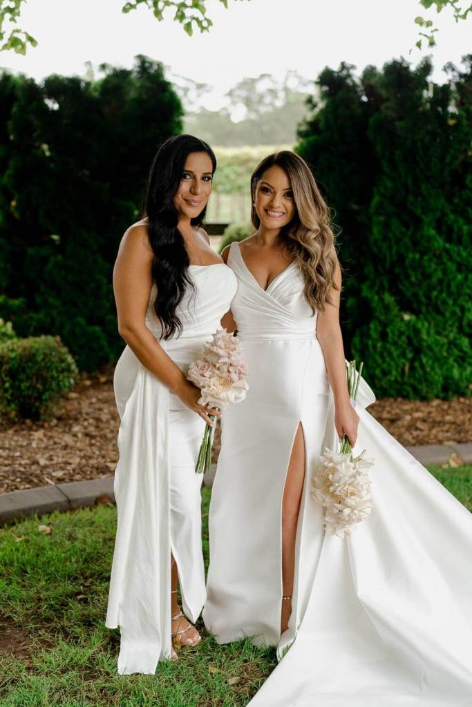Bridesmaids smiling in garden