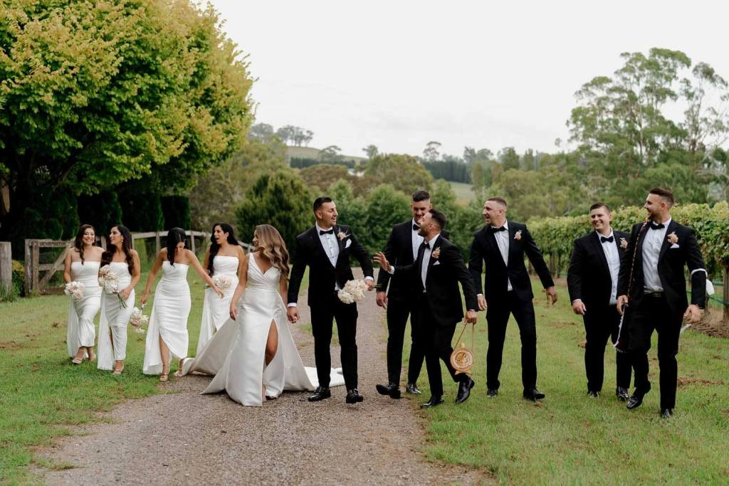 Bridal party walking in Centennial Vineyards Bowral