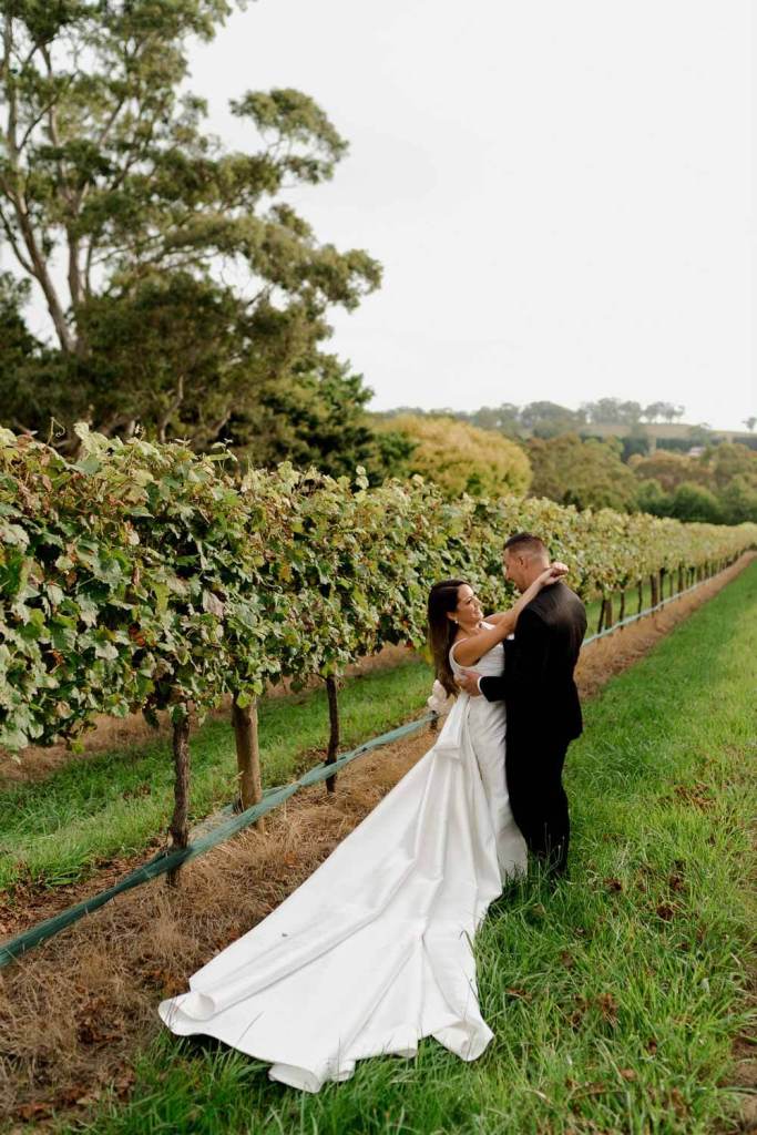 Bride and groom hugging in Centennial Vinyards Bowral
