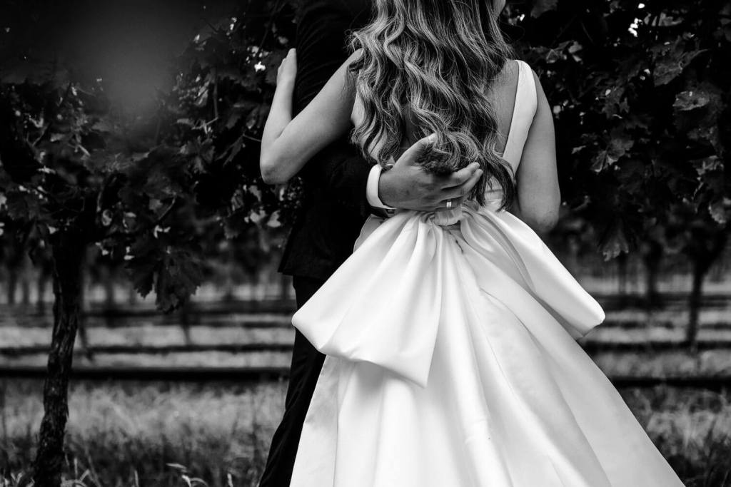 Bride and groom hugging in Centennial Vinyards Bowral