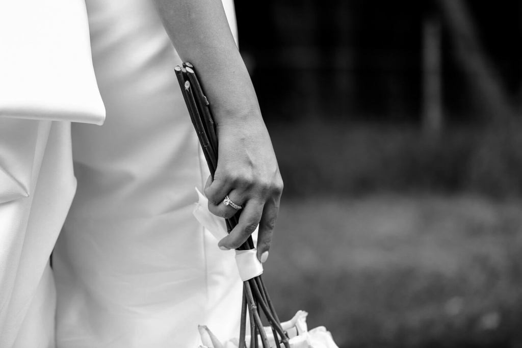 Bride holding bouquet by her side