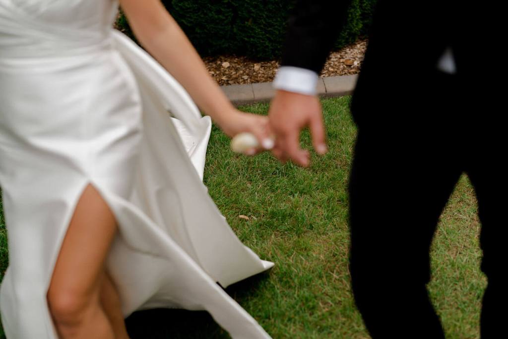 Bride and groom holding hands