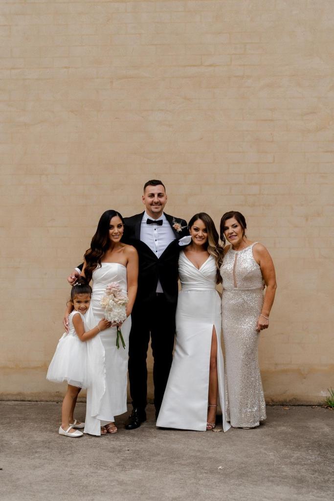 family photos on brick wall