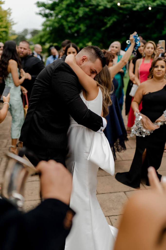 Bride and groom hugging on dancefloor