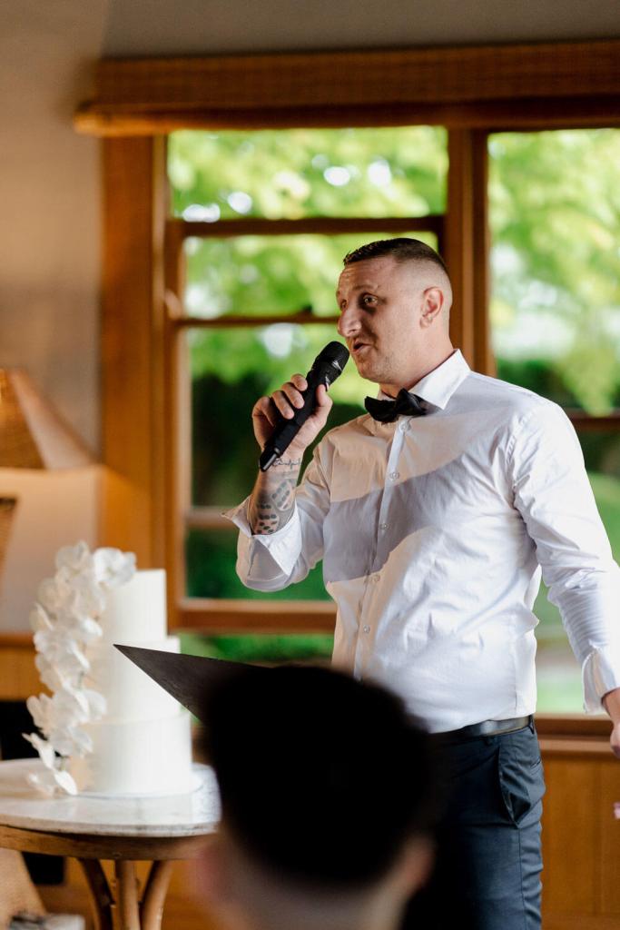 best man of groom giving wedding speech
