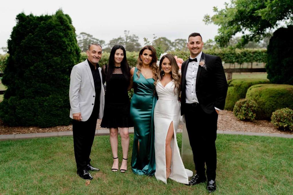 group of people smiling in garden
