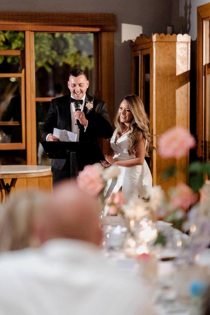 Bride and groom giving speech